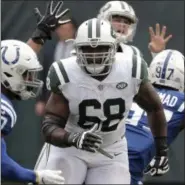  ?? SETH WENIG — ASSOCIATED PRESS, FILE ?? In this Oct. 14, 2018, file photo, New York Jets offensive tackle Kelvin Beachum (68) looks to put a block on Indianapol­is Colts linebacker Anthony Walker (50) during the first half of an NFL football game, in East Rutherford, N.J. Beachum is a big man with big blocks and an even bigger heart.