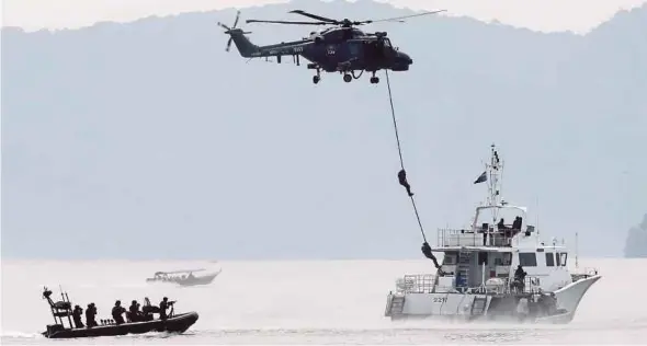  ??  ?? The Royal Malaysian Navy’s special forces putting on a show at LIMA 2019 yesterday.