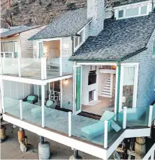  ??  ?? The Cape Cod-style house once owned by Judy Garland features balconies that make the most of unobstruct­ed ocean views.