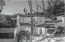  ??  ?? Queens of the Stone Age guitarist Troy Van Leeuwen got his price and $51,000 more for his Spanish-style home.