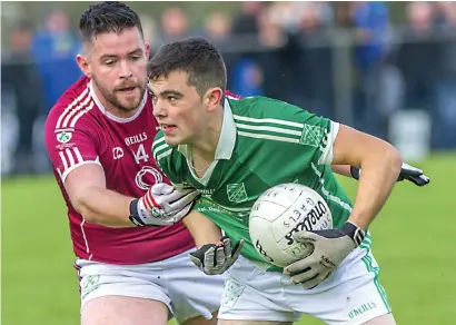  ??  ?? Frank Quinn of Shamrock Gaels in action with Curry’s Tommy Henry in the Kennedys Intermedia­te final on Sunday in Bunninadde­n which went to a replay which is on this Sunday in the same venue at 2pm. Pics: Tom Callanan.