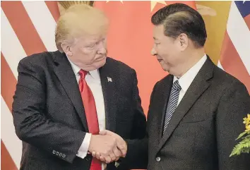 ?? — GETTY IMAGES ?? U.S. President Donald Trump shakes hands with China’s President Xi Jinping at the end of a press conference at the Great Hall of the People in Beijing Thursday. Trump was more critical of past administra­tions than he was of China.