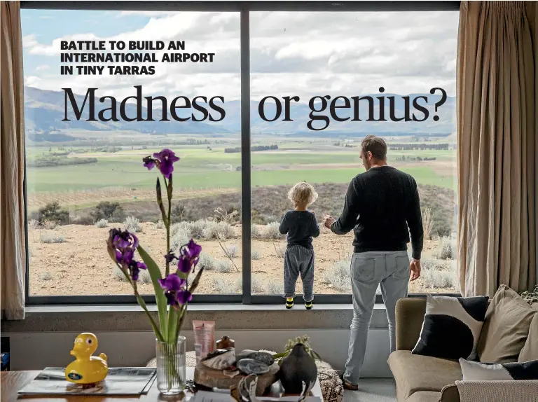  ?? Photos: Iain McGregor ?? Richie Pearce and son Marley look out their front window towards where the proposed Tarras airport would be.