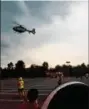  ?? DAN SOKIL - DIGITAL FIRST MEDIA ?? A PennStar medical helicopter takes off from the Target supermarke­t in Montgomery Township as storm clouds roll in above during the township’s National Night Out observance Tuesday.