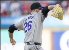  ?? CHRIS SZAGOLA — THE ASSOCIATED PRESS ?? Rockies starter Austin Gomber delivers a pitch during the first inning against the Phillies on Tuesday in Philadelph­ia.