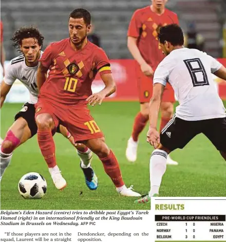  ?? AFP PIC ?? Belgium’s Eden Hazard (centre) tries to dribble past Egypt’s Tarek Hamed (right) in an internatio­nal friendly at the King Baudouin Stadium in Brussels on Wednesday.