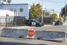  ?? Paul Chinn / The Chronicle ?? Barricades on Amador Street keep traffic away from the Vallejo police station on Wednesday, a day after the shooting.