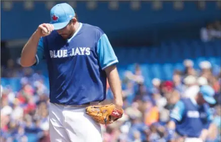  ?? CHRIS YOUNG, THE CANADIAN PRESS ?? Toronto’s starting pitcher Joe Biagini reacts after Minnesota Twins Byron Buxton hits an RBI single in the first inning, the first of his five RBIs. Biagini lasted just 3 2/3 innings, allowing nine hits, three walks and five runs, while Buxton went on...