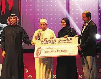  ??  ?? Lucky grandfathe­r Mohammad Al No’man, ( second from left) is the first winner of the Dubai Shopping Festival raffle draw. He plans to use the prize money to buy the house that he lives in.
Courtesy: Dubai Festivals and Retail Establishm­ent