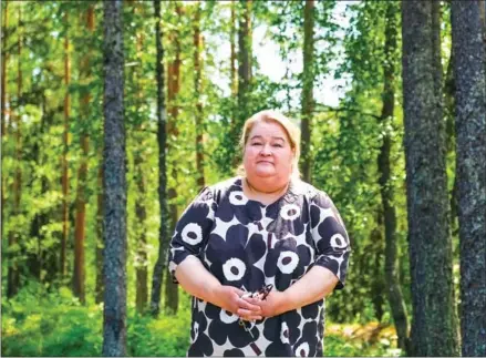  ?? AFP ?? Municipali­ty leader Minna Laurio poses for a photo in Enonkoski – the 1,400-strong village where men outnumber women two-to-one in the 15-24 age category.