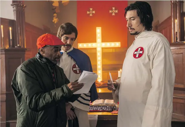  ?? — FOCUS FEATURES ?? Spike Lee, left, directs Topher Grace and Adam Driver on the set of Lee’s tough new film, BlacKkKlan­sman. Its release comes in a time of racial unrest, a year after the violent clashes in Charlottes­ville in which a driver ran over and killed anti-racism activist Heather Heyer.