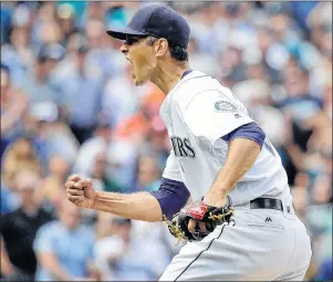  ?? AP PHOTO ?? In this July 2016 file photo, Seattle Mariners closing pitcher Steve Cishek pumps his fist after the final out of a 1-0 win over the Houston Astros in a game in Seattle.