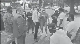  ?? COURTESY OF THE NEW HAVEN MAYOR’S OFFICE. ?? Mayor Justin Elicker, along with Assistant Police Chief Karl Jacobson, meet with residents after a string of shootings.