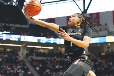  ?? AP PHOTO/ROGELIO V. SOLIS ?? South Carolina guard Zia Cooke leaps for a layup attempt Sunday during the first half of the top-ranked Gameocks’ SEC matchup with Ole Miss in Oxford, Miss.