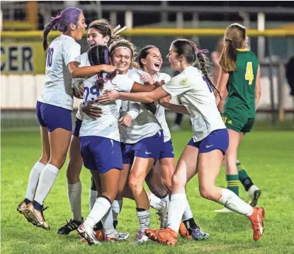  ?? PAUL KARGE/THE TIMES ?? The Byrd Lady Jackets celebrate after a goal by Natalie Dvorakova during the Division I Quarterfin­al playoff game against Captain Shreve on Feb. 13 in Shreveport, La.