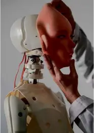  ??  ?? LEFT: A robot sex doll is fitted with a silicone face.
