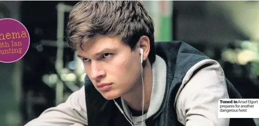  ??  ?? Tuned in Ansel Elgort prepares for another dangerous heist