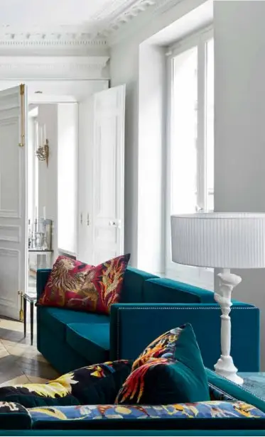  ??  ?? From left: The red marble coffee table and velvet sofas were customised by fashion designer and homeowner Alexis Mabille, with the latter featuring vintage fabric offcuts from his womenswear collection­s; A view of the bathroom from the primary bedroom