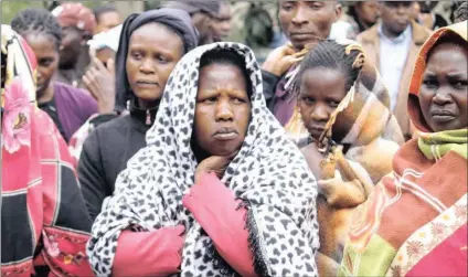  ??  ?? Relatives of 36 constructi­on workers who were killed by al-Shabaab militants in Mandera county in 2014 react after identifyin­g the bodies at City Mortuary in the Kenyan capital, Nairobi. PICTURE: XINHUA