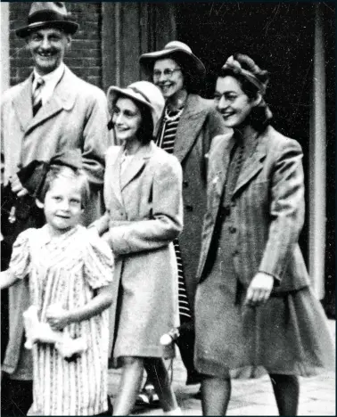  ?? ?? XXXXXX: This is a swathThis is a swathe of dummy text that can be used to indicate how many words fit a particular space. The text contains [25 words] a couple of different paragraphs so, visually
HAPPIER DAYS: Anne Frank and her father Otto, centre, in Amsterdam, 1941