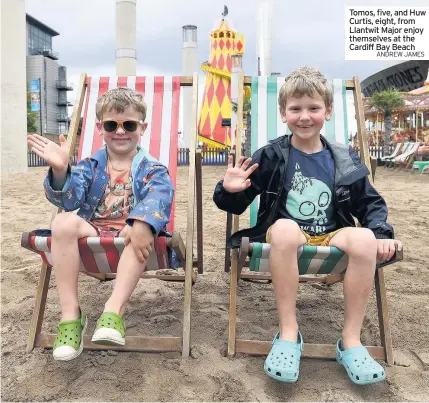  ?? ANDREW JAMES ?? Tomos, five, and Huw Curtis, eight, from Llantwit Major enjoy themselves at the Cardiff Bay Beach