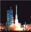  ?? AP ?? The Long March 7 rocket blasts off from the Jiuquan Satellite Launch Center. China’s growing presence in space is worrying some lawmakers.