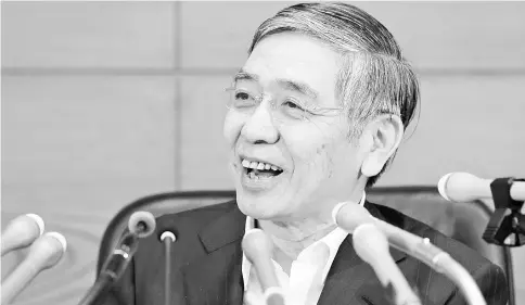  ?? — WP-Bloomberg photo ?? Kuroda, governor of the Bank of Japan (BOJ), smiles during a news conference at the central bank’s headquarte­rs in Tokyo last Thursday, June 16. The BOJ refrained from expanding monetary stimulus ahead of the UK vote on Brexit next week that could roil...
