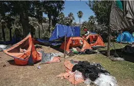  ?? Christian Chavez / Associated Press ?? Tents and belongings sit scattered on the ground a day after farmers ousted Mexican troops from La Boquilla Dam last month.