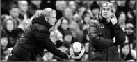  ?? DARREN STAPLES / REUTERS ?? Jose Mourinho holds the ball as his City counterpar­t, Manuel Pellegrini, looks on during the English FA Cup match on Saturday.