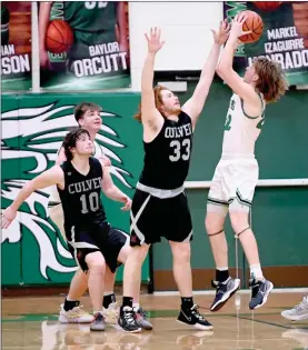  ?? PILOT PHOTO/BEV HARAMIA ?? Bremen’s AJ Ton hit what turned out to be the game-winning basket on this shot with 15 seconds left. Defending for Culver is Shane Shuman (33). Looking on are Culver’s Oliver Morgan and Bremen’s Baylor Orcutt.