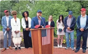  ?? BETH NAKAMURA/AP ?? Brett Eagleson, who was 15 when his father was killed in the 9/11 attack in New York, speaks Thursday at the North Plains Veterans Park.