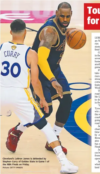  ?? Picture: GETTY IMAGES ?? Cleveland’s LeBron James is defended by Stephen Curry of Golden State in Game 1 of the NBA Finals on Friday.