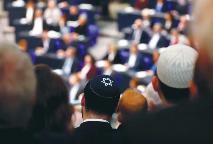  ?? (Reuters) ?? A MAN attends an Internatio­nal Holocaust Remembranc­e Day event in the European Union last month.