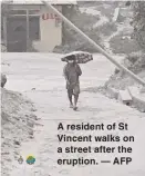  ??  ?? A resident of St Vincent walks on a street after the eruption. — AFP