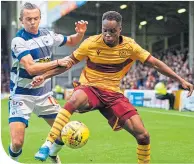  ??  ?? Sherwin Seedorf takes on Morton’s Aidan Nesbitt at Fir Park on Friday night