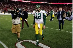  ?? AP PHOTO BY MATT YORK ?? Green Bay Packers quarterbac­k Aaron Rodgers leaves the field after their loss against the San Francisco 49ers in the NFL NFC Championsh­ip football game Sunday, Jan. 19, 2020, in Santa Clara, Calif. The 49ers won 37-20 to advance to Super Bowl 54 against the Kansas City Chiefs.