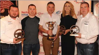  ?? Photo by Eamonn Keogh ?? Padraig Moriarty, David Devane, presenting the Jimmy Devane Memorial Cup to local father and daughter crew Pat and Tara Looney, alongside Joe McCarthy at the Rentokil Initial Killarney Historic Rally prizegivin­g ceremony.