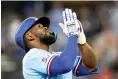  ?? AP Photo/LM Otero ?? Texas Rangers’ Adolis Garcia looks up as he runs the bases after hitting a homer Sunday against the Boston Red Sox in Arlington, Texas.