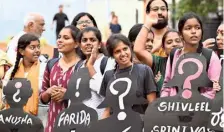  ?? ?? Members of various organisati­ons protesting against H.D. Revanna and Prajwal Revanna in Bengaluru on Friday.