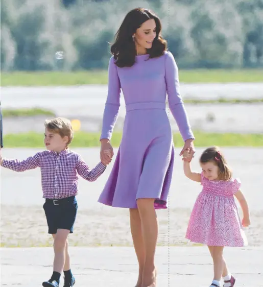  ??  ?? The Duchess of Cambridge and her children Prince George and Princess Charlotte show off their penchant for purple in Germany