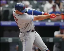  ?? DAVID ZALUBOWSKI - THE ASSOCIATED PRESS ?? New York Mets’ Pete Alonso connects for a solo home run off Colorado Rockies starting pitcher Jeff Hoffman in the sixth inning of a baseball game Wednesday, Sept. 18, 2019, in Denver.