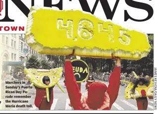  ??  ?? Marchers in Sunday’s Puerto Rican Day Parade remember the Hurricane Maria death toll.