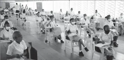  ??  ?? Students in a socially distanced classroom at the Brickdam Secondary School (Department of Public Informatio­n photo)