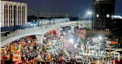  ?? — S. SURENDER REDDY ?? The Metro takes a trial run ahead of the launch as devotees head for the immersion at the MJ Market on Sunday.