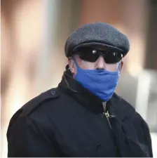  ?? NiCOLAuS CzARnECki / HERALD STAff ?? FED CAHRGES: Former Boston Police Capt. Richard Evans leaves Moakley Federal Court on Tuesday.