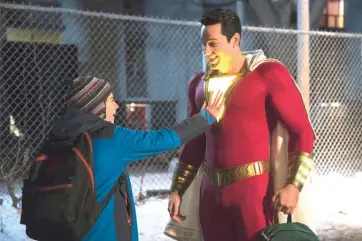  ??  ?? Grazer (left) as Freeman and Levi as the title character in ‘Shazam!’ — Courtesy of Warner Bros.