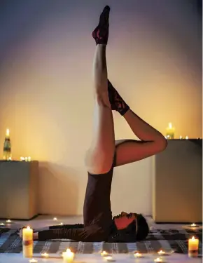 ??  ?? If you can’t find a candlelit yoga class, recreate a session in your living room