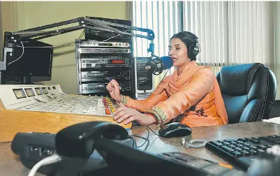  ?? DON MACKINNON FOR NATIONAL POST ?? Mandip Kaur Gill broadcasts over Radio India during a fundraisin­g telethon at the Surrey, B.C., station on Thursday. The station has been summoned to a CRTC hearing following complaints from licensed rivals, such as Shushma Datt of Rim Jhim.