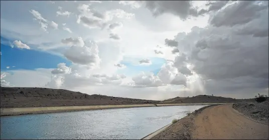  ?? Gregory Bull The Associated Press ?? Water flows along the All-american Canal, which conveys water from the Colorado River into California’s Imperial Valley.