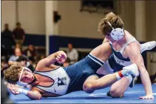  ?? NATE HECKENBERG­ER - FOR MEDIANEWS GROUP ?? Malvern Prep’s Spencer Barnhart takes down Hill School’s Cole Albert in a major decision victory in the 138-pound final.